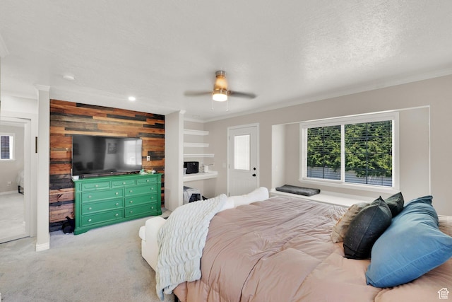 1569 Troon Cir, Syracuse, UT 84075 - bedroom featuring wooden walls, ornamental molding, light carpet, and ceiling fan