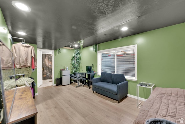 1569 Troon Cir, Syracuse, UT 84075 - bedroom with wood finished floors, recessed lighting, freestanding refrigerator, and a desk