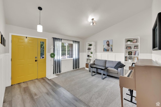 1569 Troon Cir, Syracuse, UT 84075 - foyer entrance with lofted ceiling, light wood-type flooring, and wainscoting