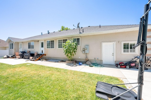 1569 Troon Cir, Syracuse, UT 84075 - back of house with a patio, a yard, stucco siding, and entry steps