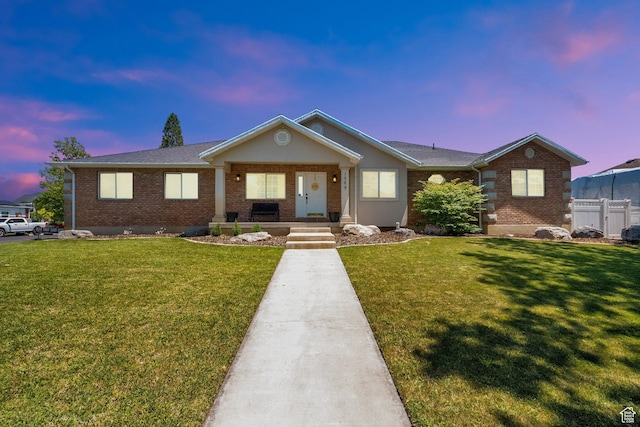 1569 Troon Cir, Syracuse, UT 84075 - single story home featuring brick siding, covered porch, and a shingled roof