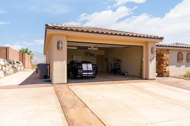4352 W 2440 S, Hurricane, UT 84737 - view of front of house featuring concrete driveway, stucco siding, and a tile roof