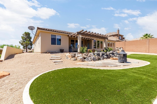 4352 W 2440 S, Hurricane, UT 84737 - back of house featuring a pergola, a tiled roof, a fenced backyard, a patio area, and stucco siding