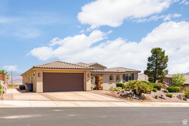 4352 W 2440 S, Hurricane, UT 84737 - mediterranean / spanish-style house with stucco siding, a garage, a tile roof, and concrete driveway