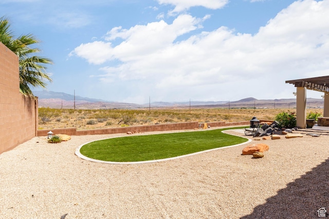 4352 W 2440 S, Hurricane, UT 84737 - view of green lawn with a mountain view and a patio