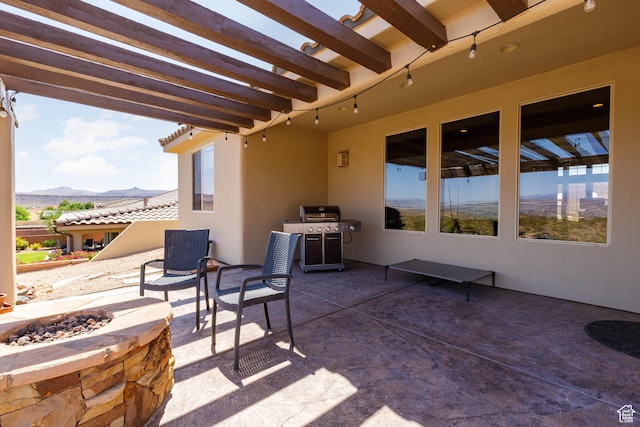 4352 W 2440 S, Hurricane, UT 84737 - view of patio featuring a fire pit, a mountain view, a grill, and a pergola