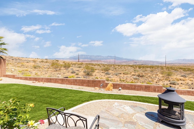 4352 W 2440 S, Hurricane, UT 84737 - view of grassy yard with a mountain view and a patio area