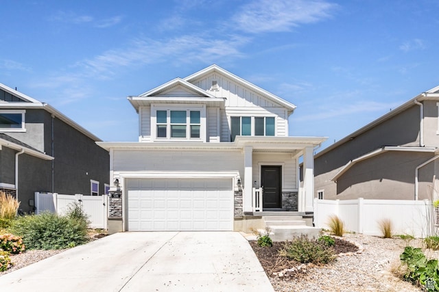 538 S Musk Ave W, Grantsville, UT 84029 - view of front of property with an attached garage, board and batten siding, stone siding, and concrete driveway