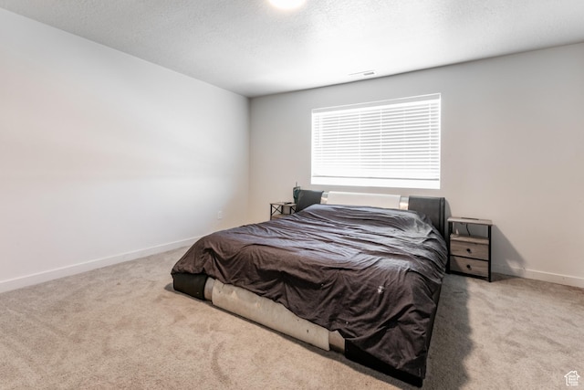 538 S Musk Ave W, Grantsville, UT 84029 - carpeted bedroom with baseboards and a textured ceiling