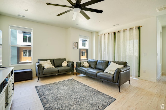 604 N Sego Way Unit 207, Farmington, UT 84025 - living room with light wood finished floors and a ceiling fan