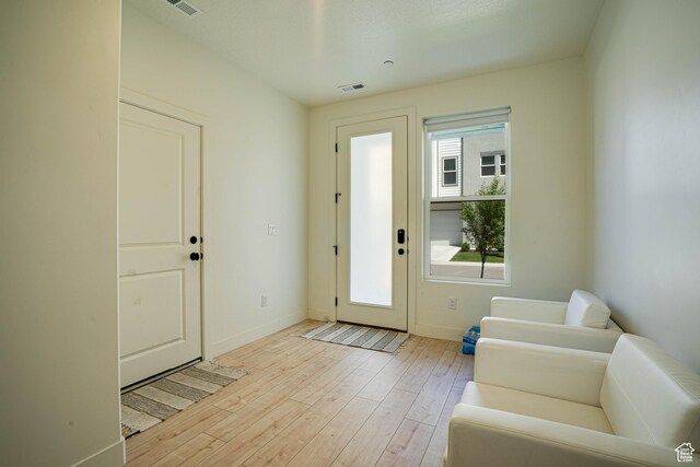 604 N Sego Way Unit 207, Farmington, UT 84025 - foyer featuring baseboards and light wood-style floors