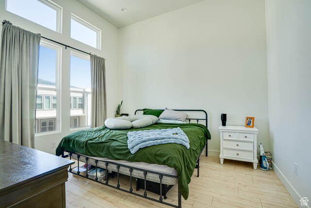 604 N Sego Way Unit 207, Farmington, UT 84025 - bedroom with light wood-style floors and baseboards