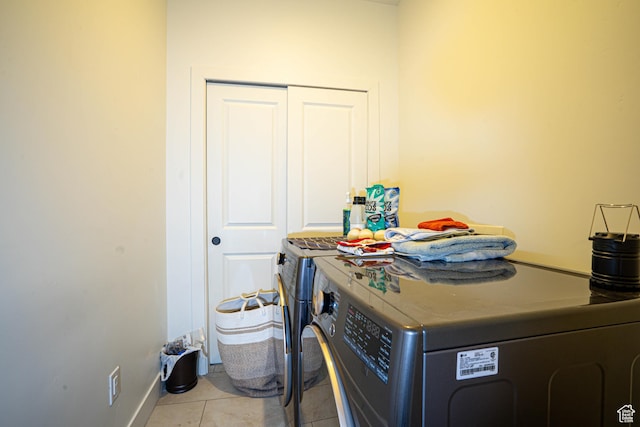 604 N Sego Way Unit 207, Farmington, UT 84025 - laundry room featuring independent washer and dryer and light tile patterned floors