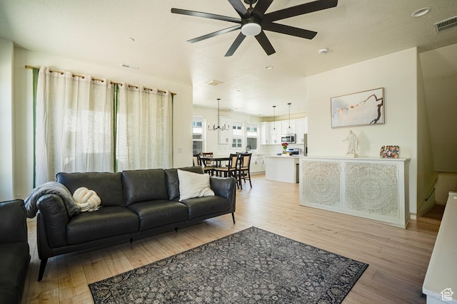 604 N Sego Way Unit 207, Farmington, UT 84025 - living area with light wood-style flooring and ceiling fan