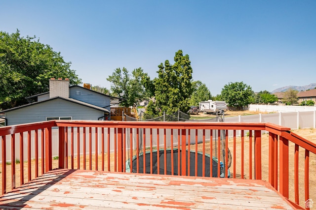 991 E Sunburn Ln, Sandy, UT 84094 - wooden deck with a fenced backyard and a mountain view