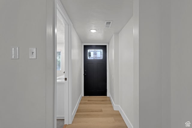 2136 Union Ave, Ogden, UT 84401 - doorway to outside featuring light wood-style flooring and baseboards