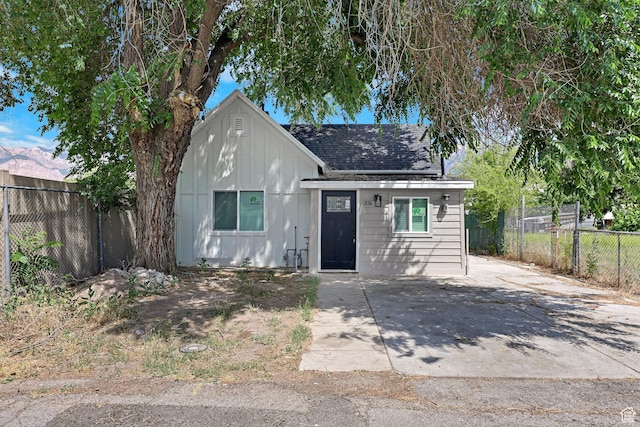 2136 Union Ave, Ogden, UT 84401 - view of front of home with a shingled roof and board and batten siding