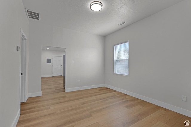 2136 Union Ave, Ogden, UT 84401 - spare room featuring light wood finished floors and a textured ceiling