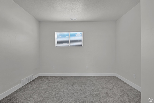 2136 Union Ave, Ogden, UT 84401 - carpeted empty room with a textured ceiling and baseboards