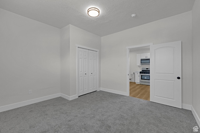 2136 Union Ave, Ogden, UT 84401 - carpeted spare room with a textured ceiling and a smoke detector