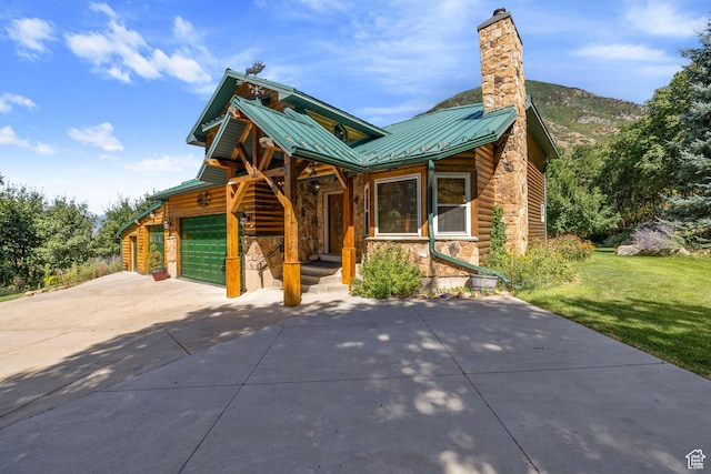 610 S Maple Dr, Woodland Hills, UT 84653 - chalet / cabin featuring stone siding, an attached garage, a metal roof, a standing seam roof, and driveway