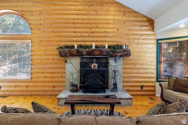 610 S Maple Dr, Woodland Hills, UT 84653 - living area with hardwood / wood-style flooring, a wood stove, rustic walls, and high vaulted ceiling