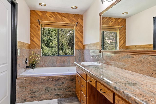 610 S Maple Dr, Woodland Hills, UT 84653 - bathroom featuring healthy amount of natural light, vanity, a bath, wood walls, and tile patterned floors