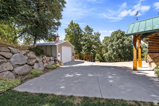 610 S Maple Dr, Woodland Hills, UT 84653 - view of patio / terrace featuring an outdoor structure and a detached garage