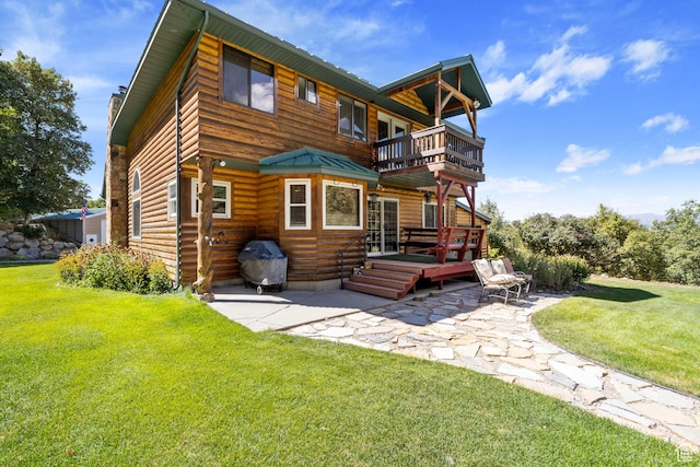 610 S Maple Dr, Woodland Hills, UT 84653 - rear view of house with a balcony, a patio, a lawn, and a wooden deck