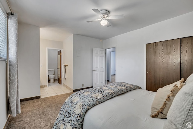 6292 S Mount Vista Dr, Taylorsville, UT 84129 - carpeted bedroom with a closet, tile patterned floors, connected bathroom, and ceiling fan