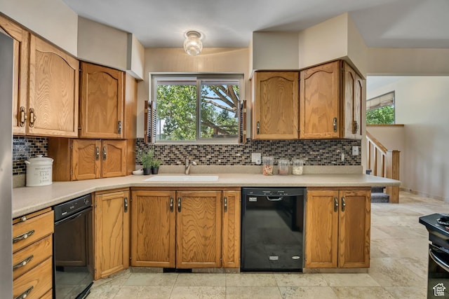 6292 S Mount Vista Dr, Taylorsville, UT 84129 - kitchen with black dishwasher, light countertops, backsplash, and brown cabinets