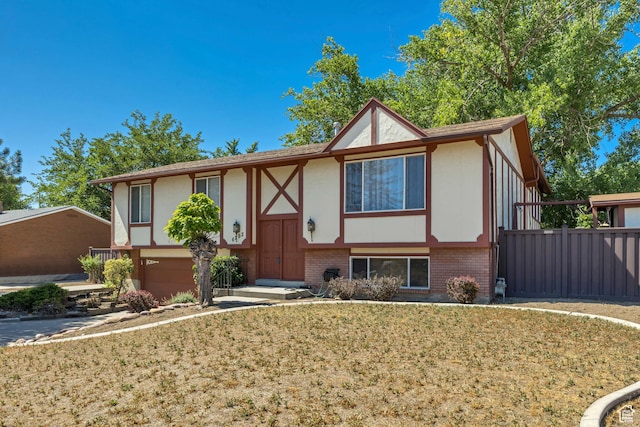 6292 S Mount Vista Dr, Taylorsville, UT 84129 - view of front of property with a garage, brick siding, and stucco siding