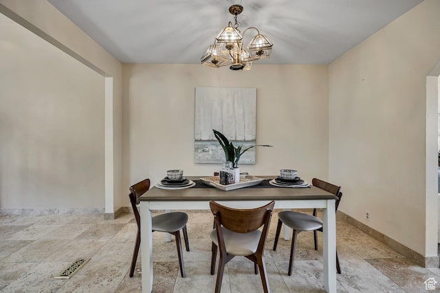 6292 S Mount Vista Dr, Taylorsville, UT 84129 - dining space with a chandelier and light stone finish floors