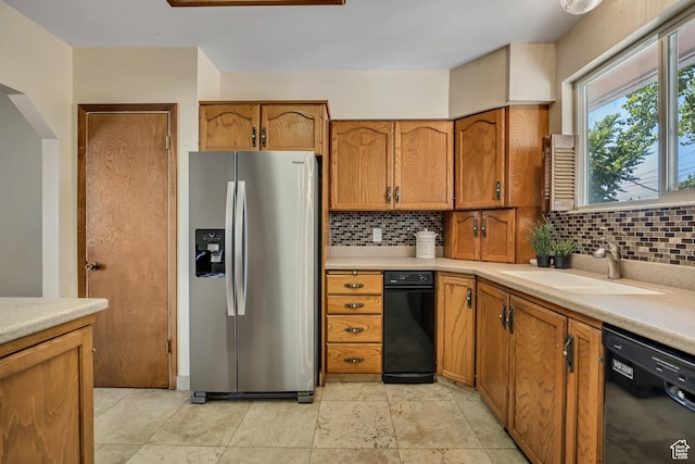 6292 S Mount Vista Dr, Taylorsville, UT 84129 - kitchen with stainless steel refrigerator with ice dispenser, dishwasher, backsplash, and brown cabinets