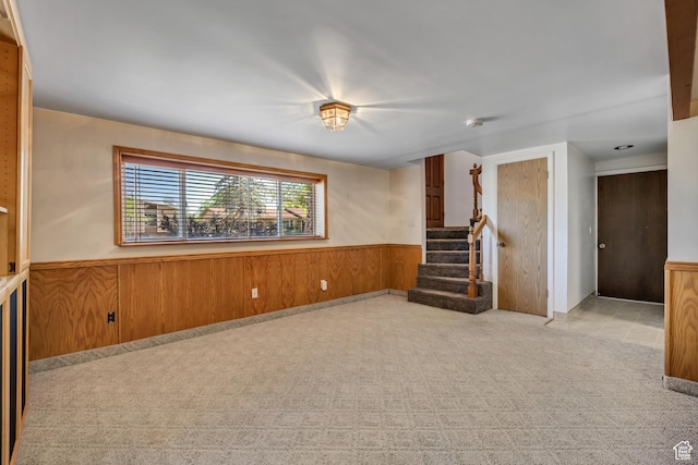 6292 S Mount Vista Dr, Taylorsville, UT 84129 - empty room with a wainscoted wall, stairway, light colored carpet, and wooden walls