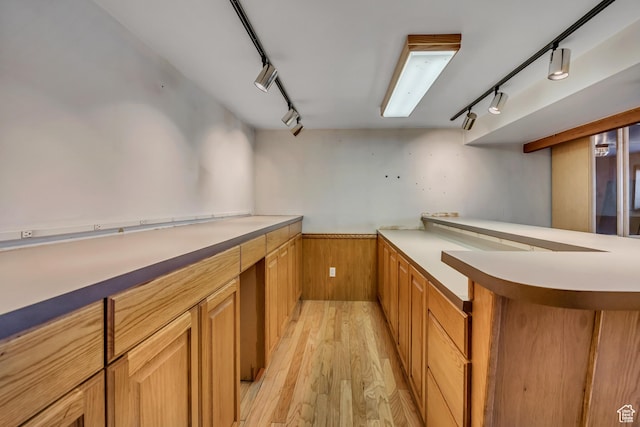 6292 S Mount Vista Dr, Taylorsville, UT 84129 - bar area featuring rail lighting, light wood-type flooring, a wainscoted wall, and wooden walls