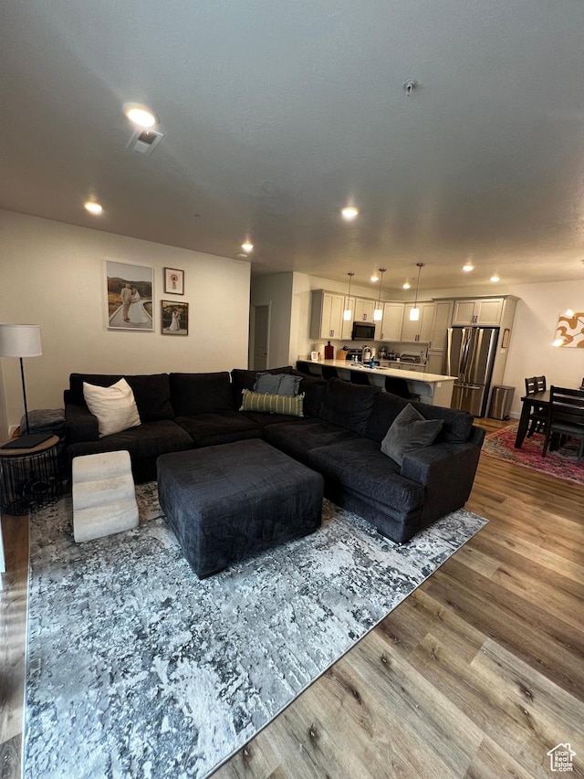 2342 E 830 S Unit 26, Spanish Fork, UT 84660 - living area featuring wood finished floors and recessed lighting