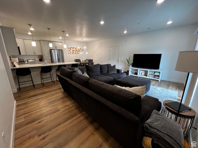 2342 E 830 S Unit 26, Spanish Fork, UT 84660 - living room with wood finished floors, recessed lighting, and a chandelier