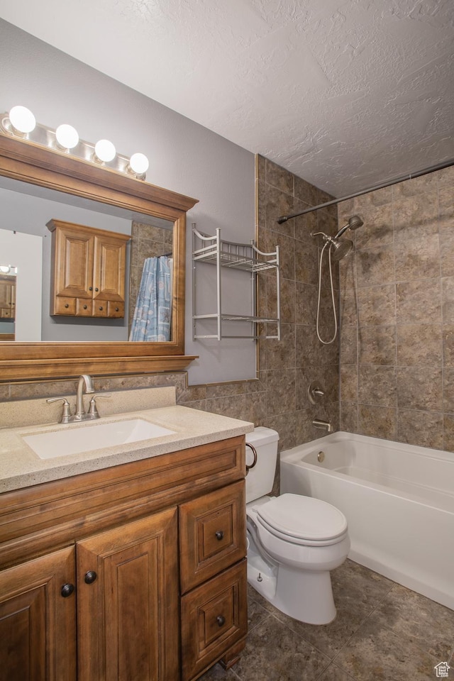 5183 W Cadenza Dr, West Jordan, UT 84081 - bathroom featuring vanity, washtub / shower combination, a textured ceiling, and tile patterned floors