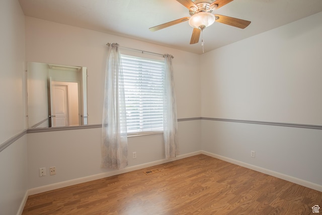 5183 W Cadenza Dr, West Jordan, UT 84081 - spare room with wood finished floors and ceiling fan