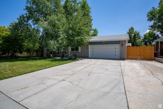5183 W Cadenza Dr, West Jordan, UT 84081 - view of front facade with brick siding, driveway, and a garage