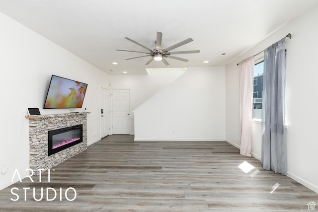 5241 S 1250 W, Riverdale, UT 84405 - unfurnished living room with a ceiling fan, wood finished floors, recessed lighting, and a glass covered fireplace