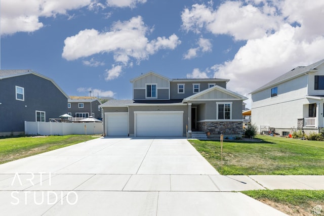 5241 S 1250 W, Riverdale, UT 84405 - view of front of house featuring board and batten siding, concrete driveway, an attached garage, and stone siding