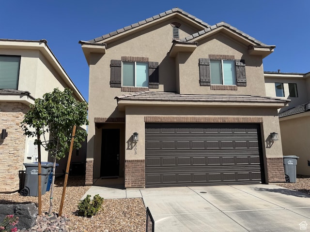 503 S Stewart Creek Cv, Washington, UT 84780 - view of front of property featuring a garage, stucco siding, and driveway