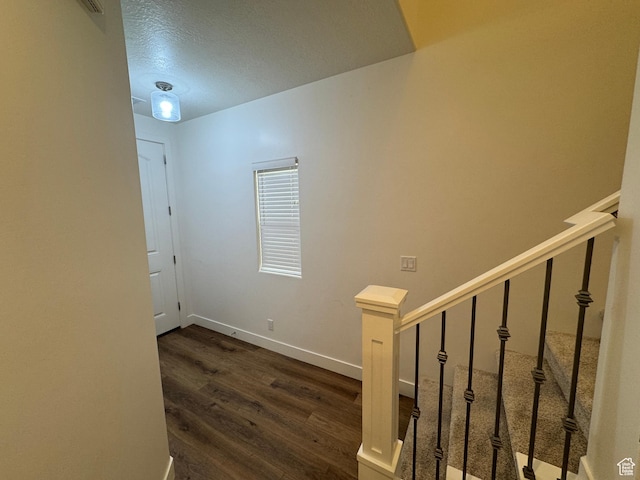 503 S Stewart Creek Cv, Washington, UT 84780 - staircase featuring wood finished floors and a textured ceiling