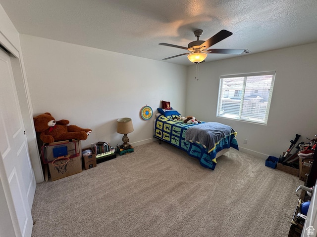 503 S Stewart Creek Cv, Washington, UT 84780 - carpeted bedroom with a textured ceiling, a closet, and a ceiling fan