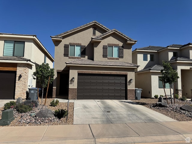 503 S Stewart Creek Cv, Washington, UT 84780 - traditional-style home featuring a garage, driveway, stucco siding, and a tile roof