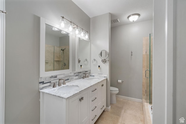 311 E Edgemont Dr S, North Salt Lake, UT 84054 - full bathroom with a stall shower, double vanity, and decorative backsplash