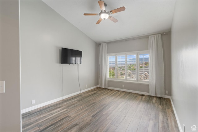 311 E Edgemont Dr S, North Salt Lake, UT 84054 - empty room with vaulted ceiling, wood finished floors, and a ceiling fan