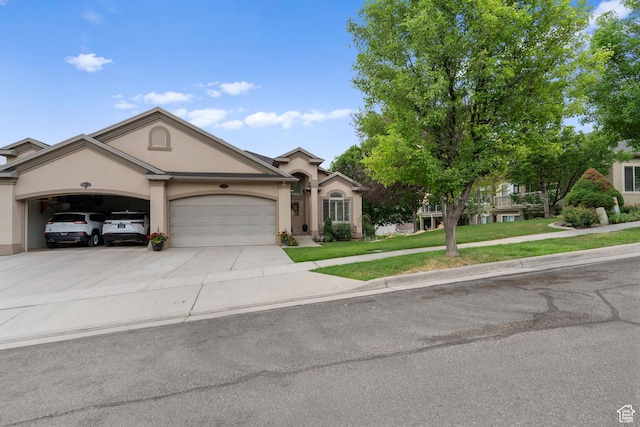 311 E Edgemont Dr S, North Salt Lake, UT 84054 - view of front of home with stucco siding, a garage, concrete driveway, and a front yard